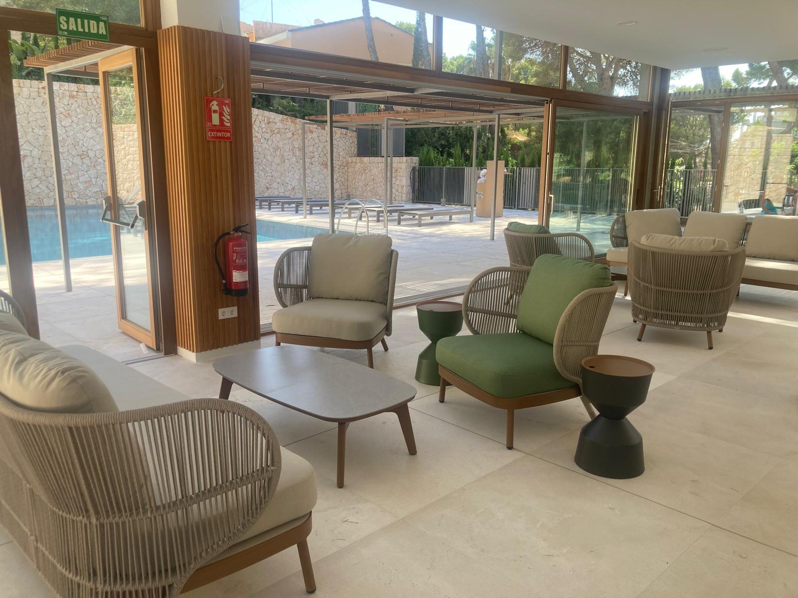 Poolside lounge with woven armchairs